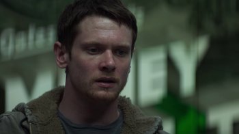 Movie still from “Money Monster” (2016), directed by Jodie Foster – A person wearing a jacket; Close Up shot, Low angle