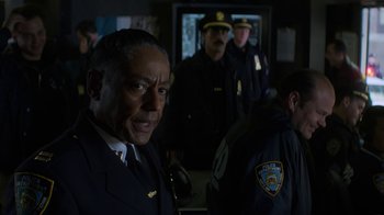 Movie still from “Money Monster” (2016), directed by Jodie Foster – A group of police officers standing next to each other; Close Up shot, Over the shoulder angle