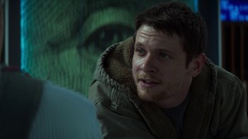 Movie still from “Money Monster” (2016), directed by Jodie Foster – A person wearing a jacket; Close Up shot, Over the shoulder angle