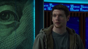 Movie still from “Money Monster” (2016), directed by Jodie Foster – A man standing in front of a wall; Close Up shot, Over the shoulder angle