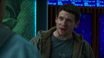 Movie still from “Money Monster” (2016), directed by Jodie Foster – A man with a surprised look on his face; Close Up shot, Over the shoulder angle