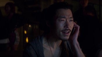 Movie still from “Money Monster” (2016), directed by Jodie Foster – A man talking on a cell phone in a dark room; Close Up shot, High angle