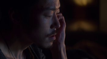 Movie still from “Money Monster” (2016), directed by Jodie Foster – A person holding his hand up to his face; Close Up shot, High angle