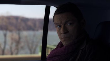 Movie still from “Money Monster” (2016), directed by Jodie Foster – A man in a car looking out the window; Close Up shot, Over the shoulder angle