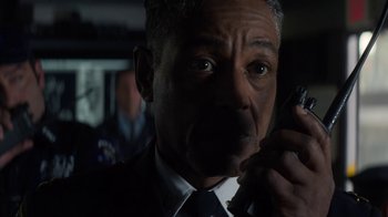 Movie still from “Money Monster” (2016), directed by Jodie Foster – A man in a suit and tie talking on a cell phone; Close Up shot, Low angle
