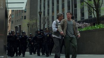 Movie still from “Money Monster” (2016), directed by Jodie Foster – A group of people walking down a street; Wide shot, Low angle