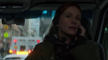 Movie still from “Money Monster” (2016), directed by Jodie Foster – A woman in a car talking on the phone; Close Up shot, High angle