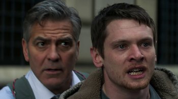 Movie still from “Money Monster” (2016), directed by Jodie Foster – A man and a man in front of each other; Close Up shot, Low angle