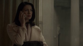 Movie still from “Money Monster” (2016), directed by Jodie Foster – A woman is talking on a cell phone; Medium shot, High angle