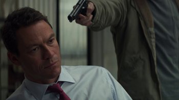 Movie still from “Money Monster” (2016), directed by Jodie Foster – A man is holding a gun up to his head; Close Up shot, Over the shoulder angle