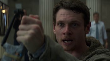 Movie still from “Money Monster” (2016), directed by Jodie Foster – A person holding something in his hand; Close Up shot, Low angle