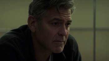 Movie still from “Money Monster” (2016), directed by Jodie Foster – A person wearing a black shirt; Close Up shot, Low angle