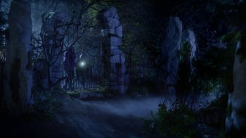 Movie still from “Monster High: The Movie” (2022), directed by Todd Holland – Two people standing in the woods at night with a flashlight; Extreme Wide shot, Low angle