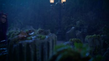 Movie still from “Monster High: The Movie” (2022), directed by Todd Holland – A view of a street light from the ground; Wide shot, Low angle