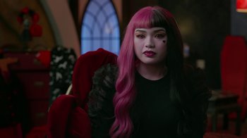 Movie still from “Monster High: The Movie” (2022), directed by Todd Holland – A woman with pink and black long hair; Close Up shot, Over the shoulder angle