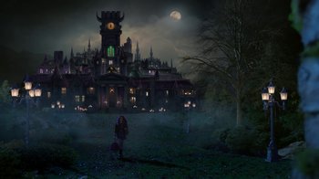 Movie still from “Monster High: The Movie” (2022), directed by Todd Holland – A person standing in front of a large building; Extreme Wide shot, Low angle