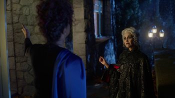 Movie still from “Monster High: The Movie” (2022), directed by Todd Holland – Two women dressed up in costumes talking to each other; Medium shot, Over the shoulder angle