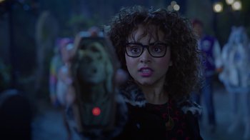 Movie still from “Monster High: The Movie” (2022), directed by Todd Holland – A woman holding a cell phone in front of her face; Close Up shot, Over the shoulder angle