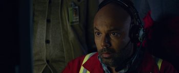 Movie still from “Monster Trucks” (2016), directed by Chris Wedge – A person wearing a red jacket; Close Up shot, High angle
