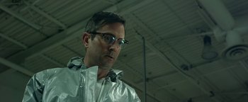 Movie still from “Monster Trucks” (2016), directed by Chris Wedge – A man wearing a silver jacket and glasses; Close Up shot, Low angle