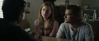 Movie still from “Monster Trucks” (2016), directed by Chris Wedge – A woman sitting at a table next to a young man; Close Up shot, Over the shoulder angle