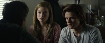 Movie still from “Monster Trucks” (2016), directed by Chris Wedge – A woman sitting next to a man in front of a computer screen; Close Up shot, Over the shoulder angle