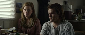 Movie still from “Monster Trucks” (2016), directed by Chris Wedge – A man and a woman sitting next to each other looking at a computer screen; Close Up shot, Over the shoulder angle