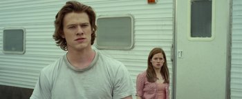 Movie still from “Monster Trucks” (2016), directed by Chris Wedge – A man and a woman standing next to each other; Close Up shot, Low angle