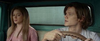 Movie still from “Monster Trucks” (2016), directed by Chris Wedge – A man and a woman sitting in a car; Close Up shot, Over the shoulder angle