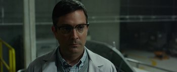 Movie still from “Monster Trucks” (2016), directed by Chris Wedge – A person wearing glasses and a lab coat; Close Up shot, Over the shoulder angle