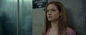 Movie still from “Monster Trucks” (2016), directed by Chris Wedge – A woman standing in front of a conference room sign; Close Up shot, Low angle