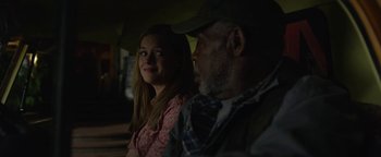 Movie still from “Monster Trucks” (2016), directed by Chris Wedge – A girl and an older man sitting next to each other; Close Up shot, Over the shoulder angle