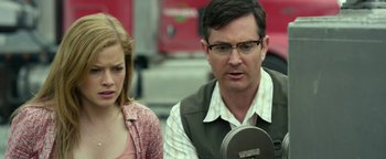 Movie still from “Monster Trucks” (2016), directed by Chris Wedge – A man and a woman looking at something on a table; Close Up shot, Over the shoulder angle