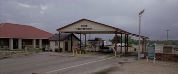 Movie still from “Monster's Ball” (2001), directed by Marc Forster – A state penitentiary building with a stop sign; Extreme Wide shot, High angle