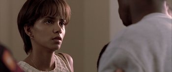 Movie still from “Monster's Ball” (2001), directed by Marc Forster – A woman is looking at a man in a room; Close Up shot, Over the shoulder angle