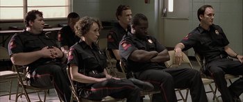 Movie still from “Monster's Ball” (2001), directed by Marc Forster – A group of police officers sitting in a room; Medium shot, Over the shoulder angle