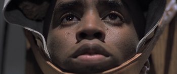 Movie still from “Monster's Ball” (2001), directed by Marc Forster – A man's face with a lot of skin on his face; Extreme Close Up shot, Low angle