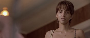 Movie still from “Monster's Ball” (2001), directed by Marc Forster – A person wearing a necklace; Close Up shot, Over the shoulder angle