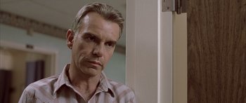 Movie still from “Monster's Ball” (2001), directed by Marc Forster – A person wearing a striped shirt; Close Up shot, Low angle