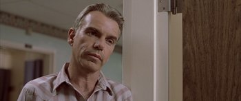 Movie still from “Monster's Ball” (2001), directed by Marc Forster – A person wearing a striped shirt; Close Up shot, Low angle