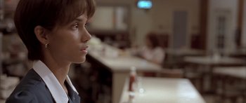 Movie still from “Monster's Ball” (2001), directed by Marc Forster – A woman sitting at a counter in a restaurant; Close Up shot, Over the shoulder angle