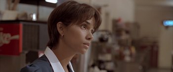 Movie still from “Monster's Ball” (2001), directed by Marc Forster – A person with short brown hair; Close Up shot, Over the shoulder angle