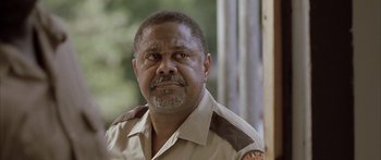 Movie still from “Monster's Ball” (2001), directed by Marc Forster – A person wearing a uniform; Close Up shot, Low angle