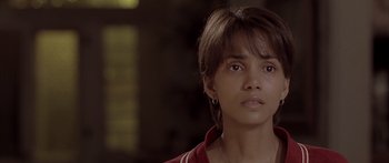 Movie still from “Monster's Ball” (2001), directed by Marc Forster – A person wearing a red shirt; Close Up shot, Over the shoulder angle