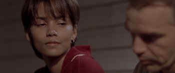 Movie still from “Monster's Ball” (2001), directed by Marc Forster – A person wearing a red jacket; Close Up shot, High angle