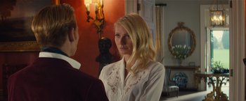 Movie still from “Mortdecai” (2015), directed by David Koepp – A woman in a white shirt is talking to a man in a red shirt; Close Up shot, Over the shoulder angle