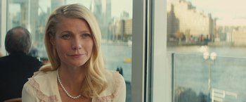 Movie still from “Mortdecai” (2015), directed by David Koepp – A woman with long blonde hair wearing a white blouse; Close Up shot, Over the shoulder angle