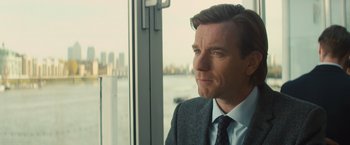 Movie still from “Mortdecai” (2015), directed by David Koepp – A person wearing a suit and tie; Close Up shot, Over the shoulder angle