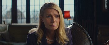 Movie still from “Mortdecai” (2015), directed by David Koepp – A woman with long blonde hair sitting in a chair; Close Up shot, Over the shoulder angle
