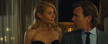 Movie still from “Mortdecai” (2015), directed by David Koepp – A man and a woman standing next to each other; Close Up shot, Over the shoulder angle